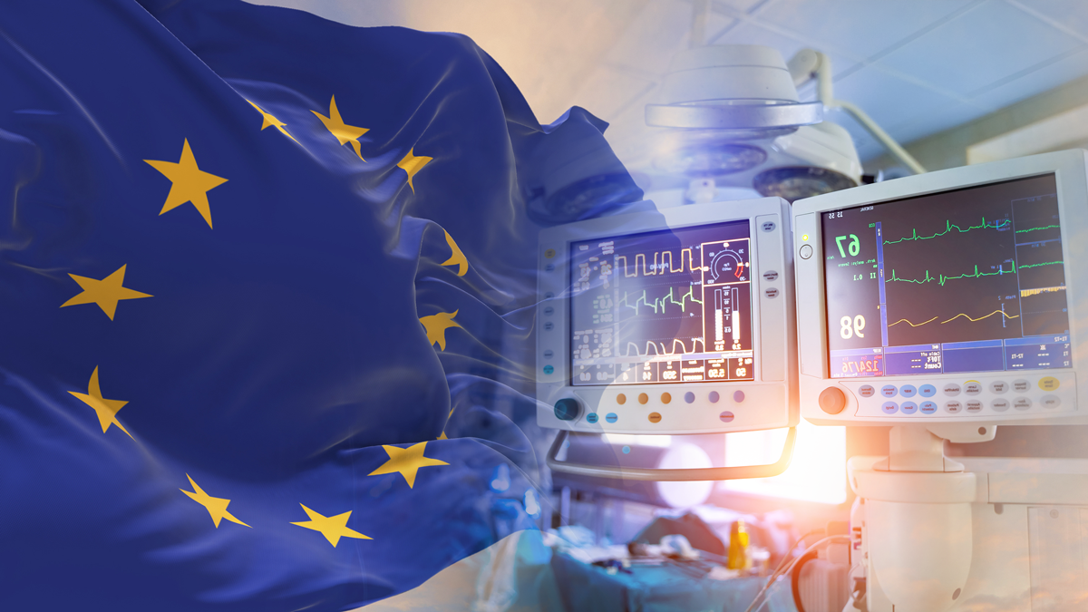 A European Union Flag fades into a photo of an operating room
