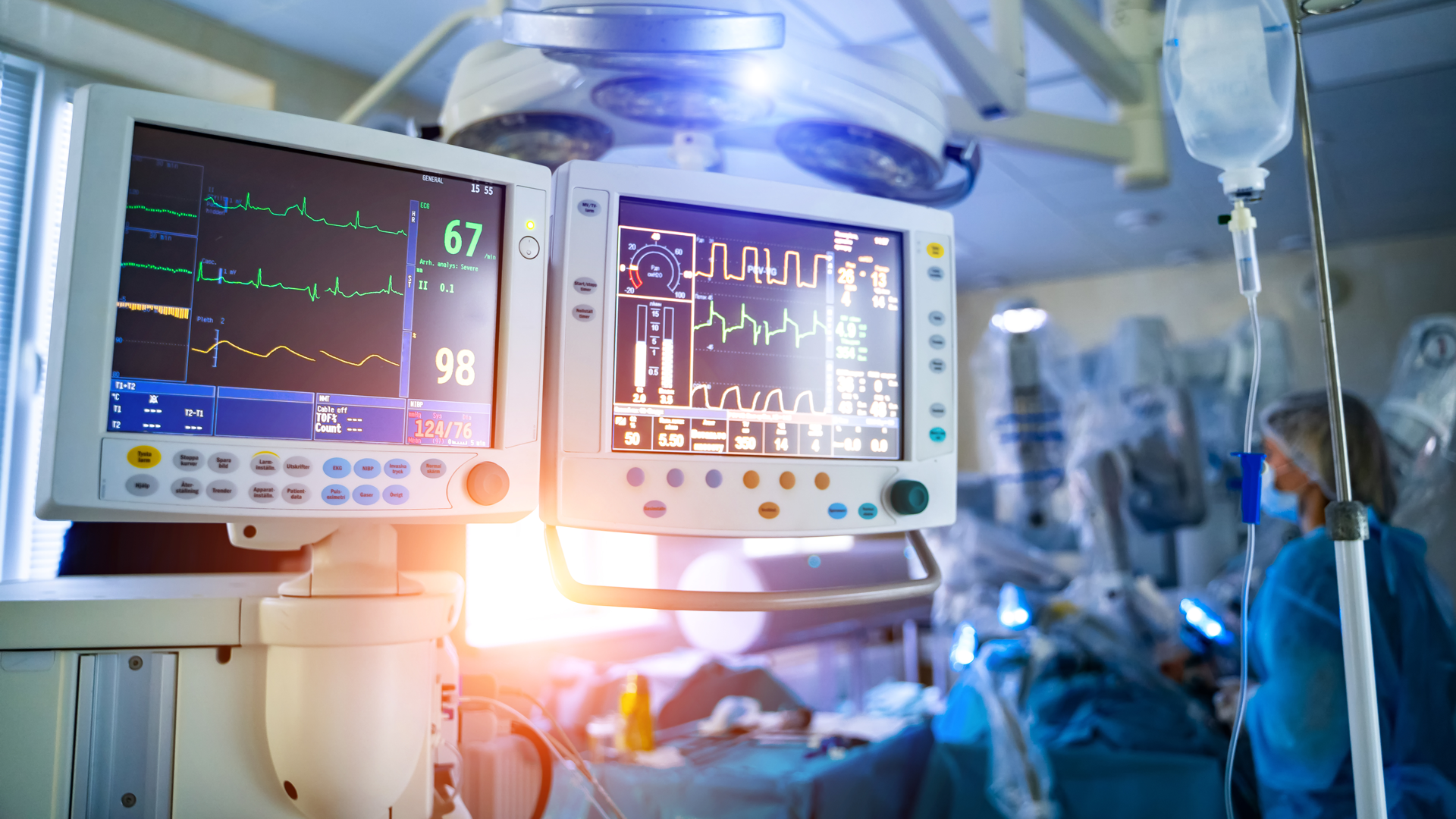 Medical devices including a ventilator and EKG are shown in an emergency room.