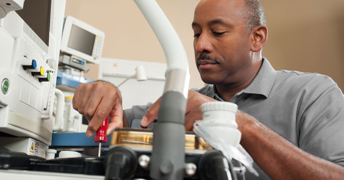 TRIMEDX-003_cropped A TRIMEDX employee services a medical device